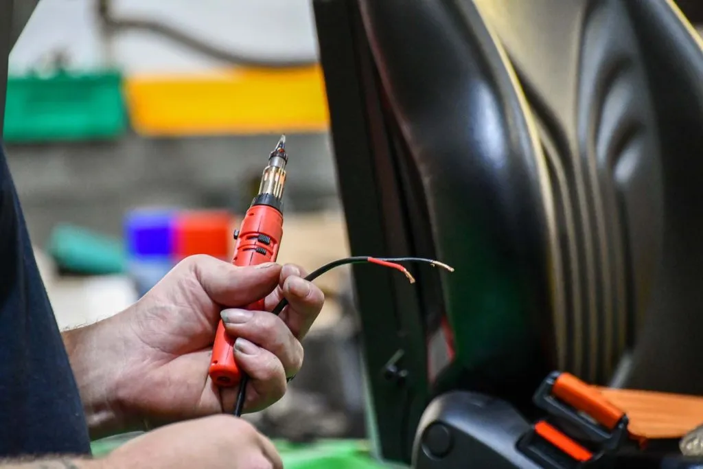 Acclaim Handling engineer testing the wiring on a forklift during a service