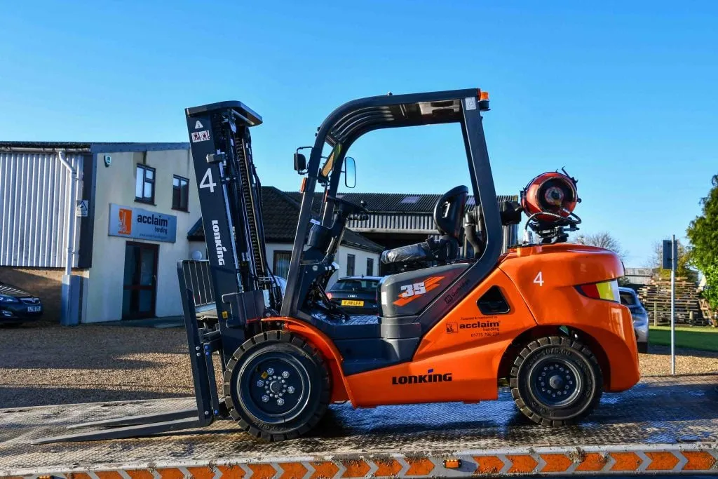 A forklift loaded on an Acclaim Handling lorry for delivery