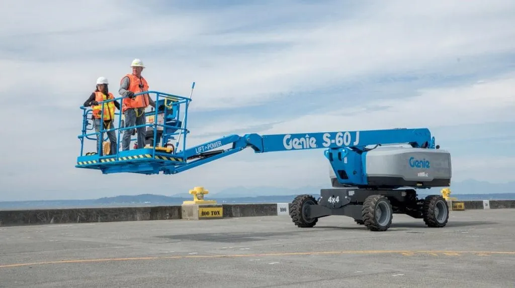 Self-propelled telescopic boom lift with two people in the platform