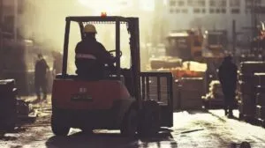 A Construction Worker Operating a Forklift in a Construction Zone
